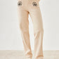 Pantalón elástico tipo jeans con flor VOLANS - Little MooN